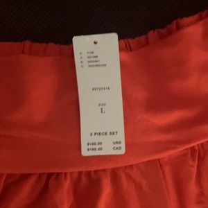 Two piece cozy pants set . Reddish/orange color.